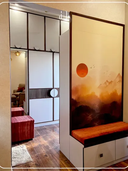 A unique design element in a bedroom, featuring a seating area with storage integrated into a partition wall. The beautiful artwork adds a splash of color and personality.