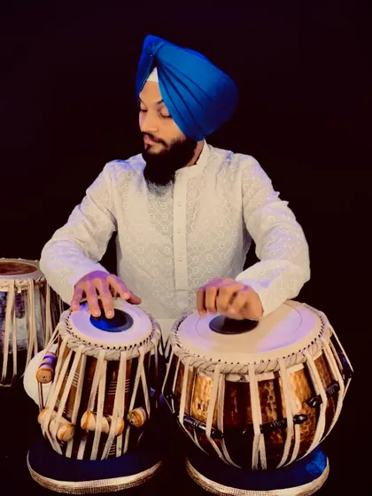 Another portrait from my photoshoot. The vibrant blue of my turban contrasts with the natural wood of the tabla.