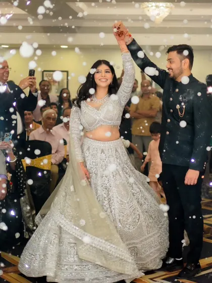 The couple's first dance, surrounded by bubbles. Her makeup is set to be picture-perfect through every activity.