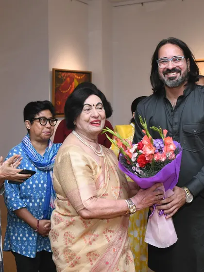 A happy moment receiving flowers from a distinguished guest at the opening ceremony. The warmth and support from the community is truly humbling.