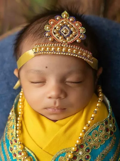 The face of an angel. This close-up captures the divine look of the Little Krishna theme perfectly.