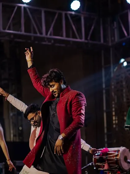 A dynamic shot of a group dance performance at the Udaipur destination Sangeet.