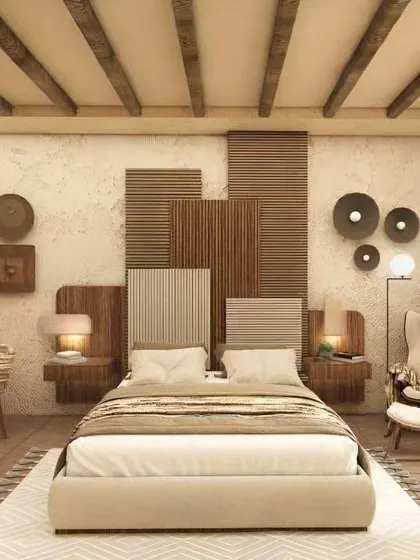 This bedroom design uses a mix of wood, textured wallpaper, and decorative wall art to create a rustic yet refined look. The layered headboard and warm lighting add depth and character.