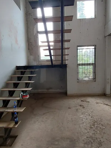 Before: The original metal staircase frame in the 'House of Kismish' project, a purely functional element.