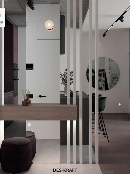 A clever room divider with an integrated console table separates the entryway from the main living space while allowing light and views to pass through.