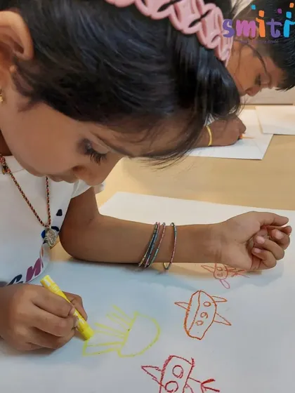 After the museum visit, a child draws airplanes and jets, translating her exciting experience into art.