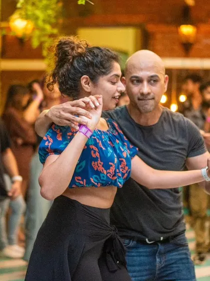 A close and focused dance, with both partners in the zone.
