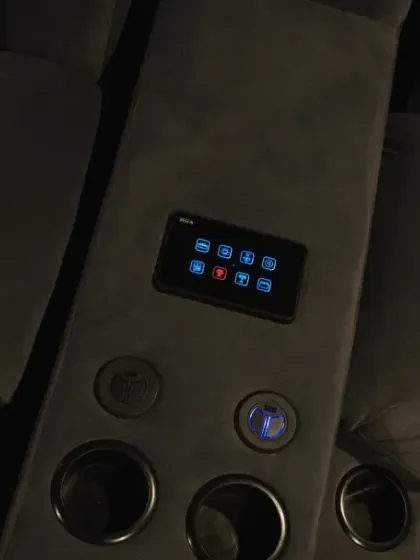 This view shows the full console with the larger control panel and illuminated cup holders, which are also part of the automation system. It's these small details that create a true luxury experience.