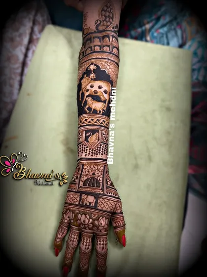 A full arm bridal design that is rich with symbolism. It features a cow with its calf, representing love and nurturing, alongside portraits and other traditional wedding motifs.