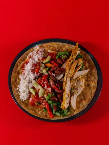A top-down view of the Chicken Burrito Wrap before it's rolled. It's a balanced and flavorful combination that's perfect for a healthy lunch or dinner.
