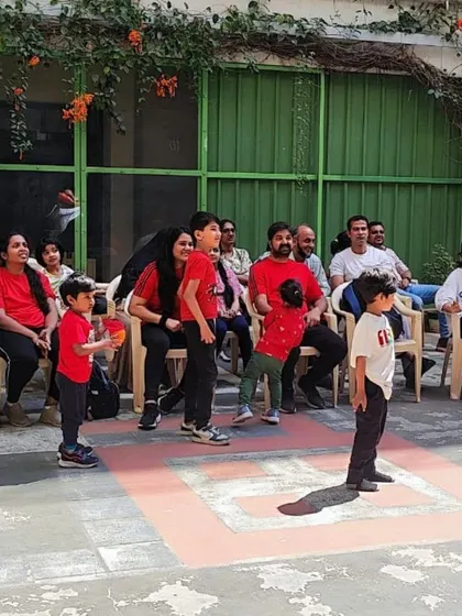 Parents and children enjoying our annual sports day. We foster a strong sense of community at our school.