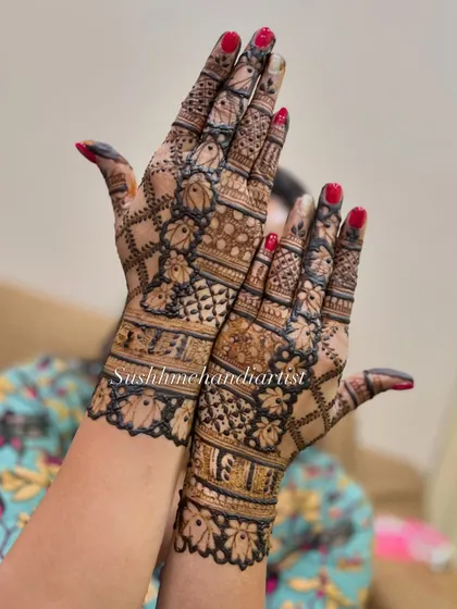 A beautiful example of a full-coverage design with a mix of floral and geometric patterns, perfect for a bride's sister or close friend.