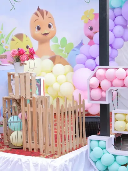 A detailed shot of the props used in our Katuri theme, including wooden crates and a house-shaped shelf filled with balloons.