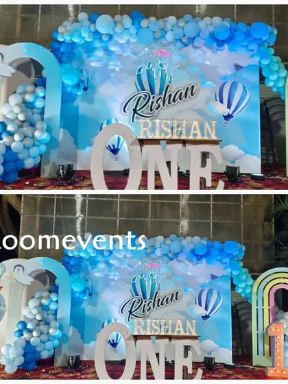 A side-by-side comparison showing the versatility of the hot air balloon theme. The setup includes a sky-blue backdrop, balloon clouds, and large 'ONE' letters for the birthday boy.
