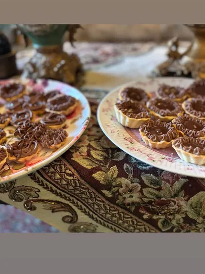 Platters of my divine chocolate tarts, ready to be served at a party. They are always a crowd-pleaser.