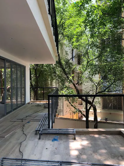 A client's new, empty balcony. This was our blank canvas, a space filled with potential to bring the feeling of her childhood garden into her new home.