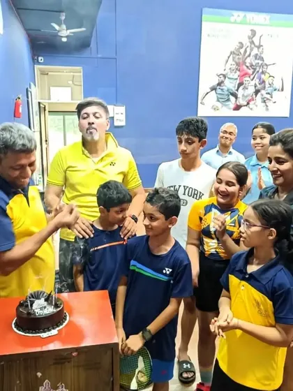 The kids and I gather around to celebrate Coach Prafull's birthday after a training session.