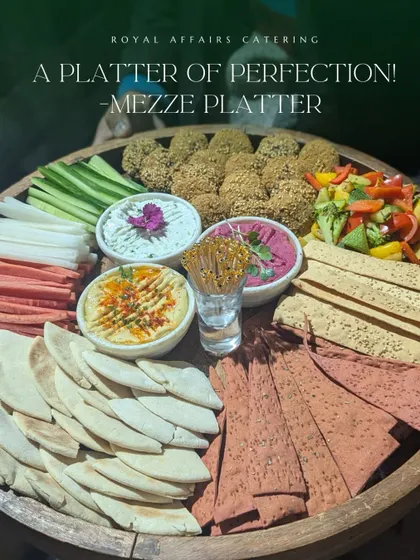 My Mezze Platter is a journey of Mediterranean flavors. It includes freshly made falafel, creamy hummus and beetroot dip, tzatziki, assorted vegetable sticks, and a variety of pita and lavash breads.