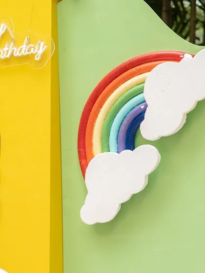 A close-up of the rainbow prop from the Cocomelon party. The bright, cheerful colors are central to the theme and bring an instant smile to everyone's face.