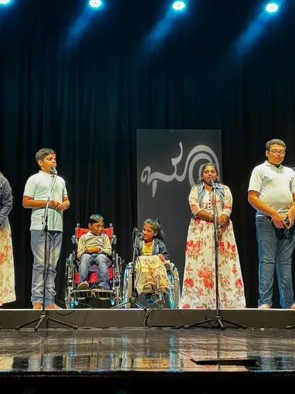 A full stage view of the Srishti Special Academy students during their performance. We ensured the concert was accessible and empowering for everyone, including performers in wheelchairs, celebrating ability in every form.