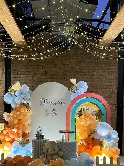 A closer look at the Teddy Bear party setup, highlighting the pastel balloon colors and personalized backdrop.