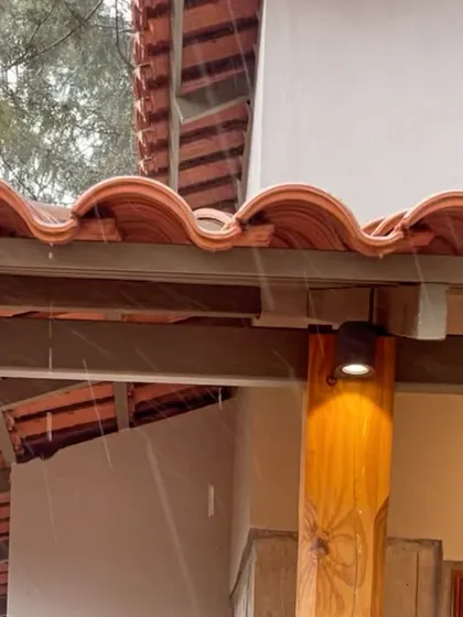 Rain falling on the newly installed terracotta roof tiles at TARA. Even during construction, the connection to nature is palpable.