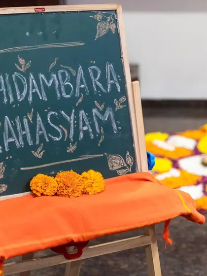 The stage is set for our offering. This simple welcome sign at the entrance captures the essence of the evening, an intimate and heartfelt exploration of the 'Chidambara Rahasyam', the secret of the heart space.
