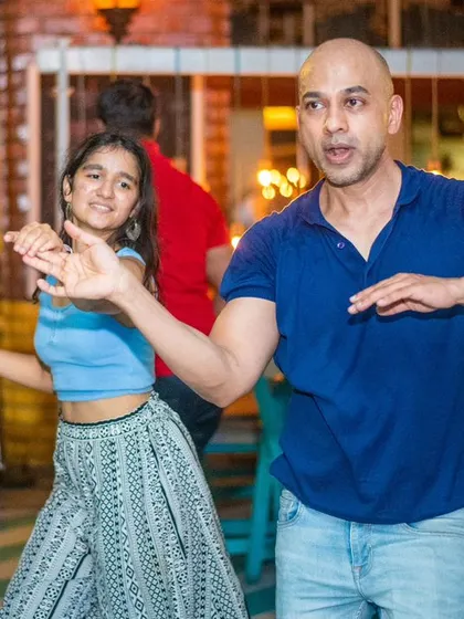 A fun and energetic moment, with the lead dancer showing off some flair.