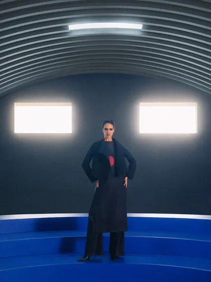 A powerful wide shot from another Payal Khandwala campaign. The stark, symmetrical architecture and bold blue floor create a futuristic setting for the minimalist ensemble.