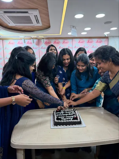 A moment of shared joy as our graduates cut the cake together. This is what our community is all about.