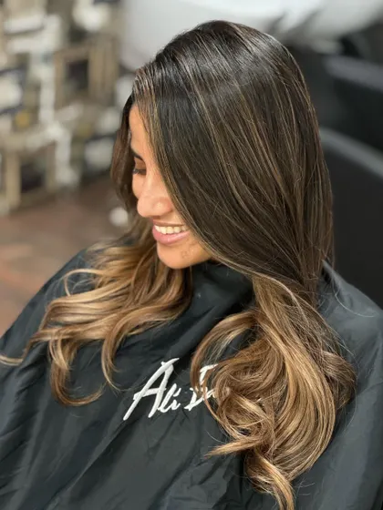 A hair transformation at its best, with a happy, smiling client.