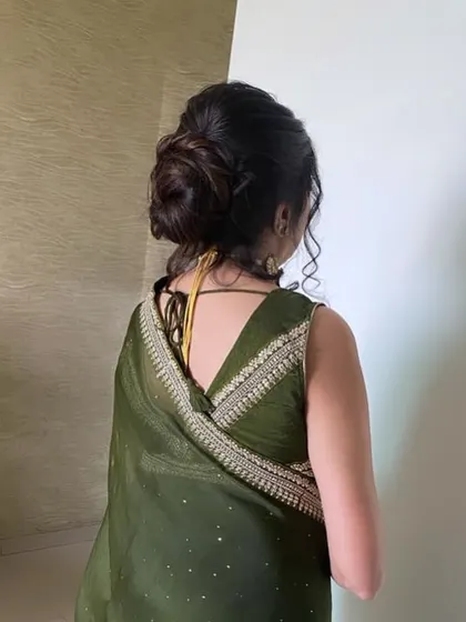 A view of the beautiful and intricate updo for this client. The hairstyle is classic, elegant, and designed to last all day.