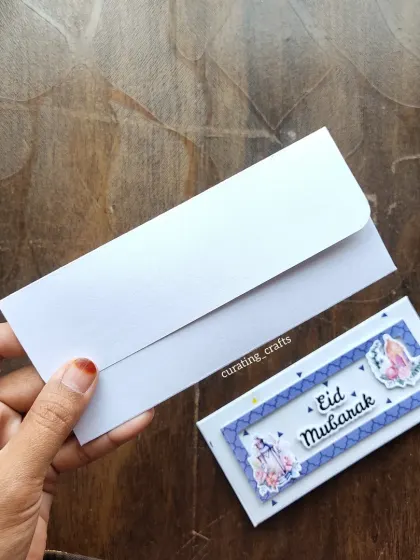 A simple yet elegant Eidi envelope, shown with its matching plain white outer envelope.