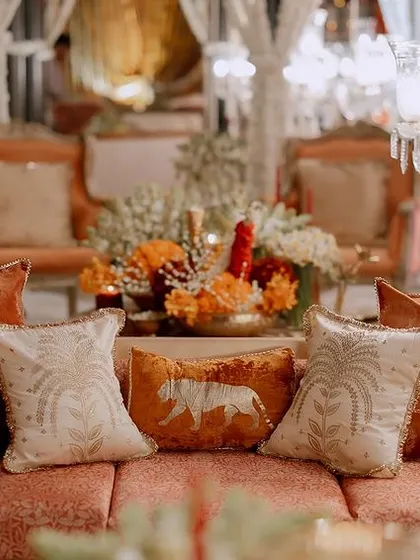 We designed this lounge with plush, orange velvet sofas and custom-embroidered cushions. The intricate details and luxurious fabrics create a comfortable yet royal seating experience for guests.