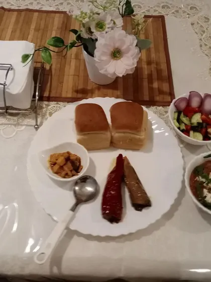 A simple and satisfying meal of pav bhaji, salad, and our stuffed chilli and mango pickles. This is comfort food for us.