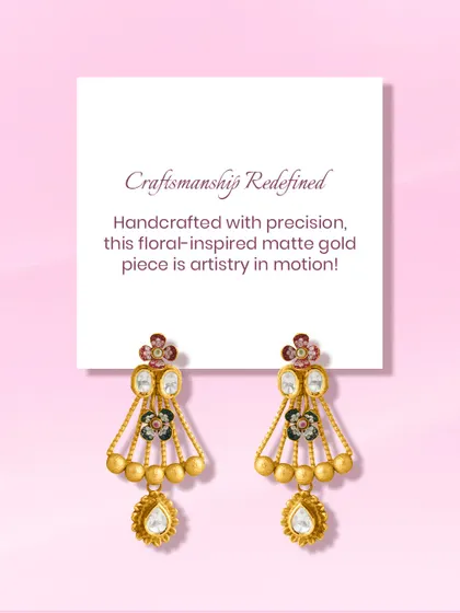 Grace in every curve, art in every detail. This floral-inspired matte gold earring is a masterpiece in motion, featuring enamel work and a polki drop, crafted to captivate.