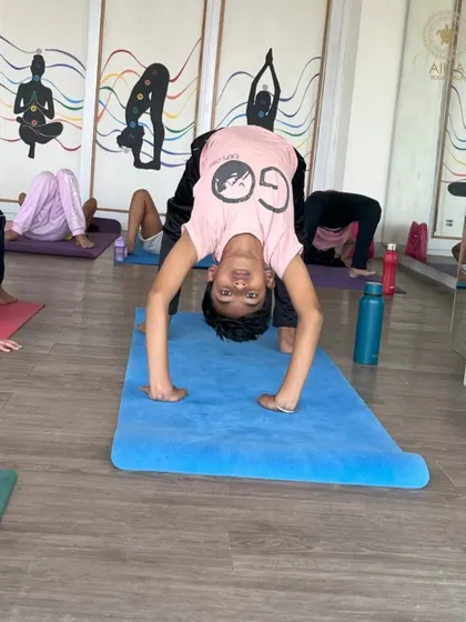 This little yogi shows incredible flexibility and fearlessness in Chakrasana (Wheel Pose). Our kids' yoga classes are designed to be playful, helping them explore their physical potential safely.