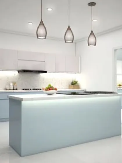 A minimalist kitchen island with built-in lighting creates a stunning focal point in this modern space. The clean lines and simple color palette of light blue and white make the room feel serene and uncluttered.