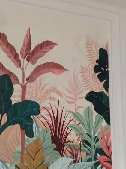 A closer look at the tropical leaf wallpaper installed on wardrobe panels. The rich colors and detailed botanical illustrations create a custom, high-end look that completely transforms the furniture.