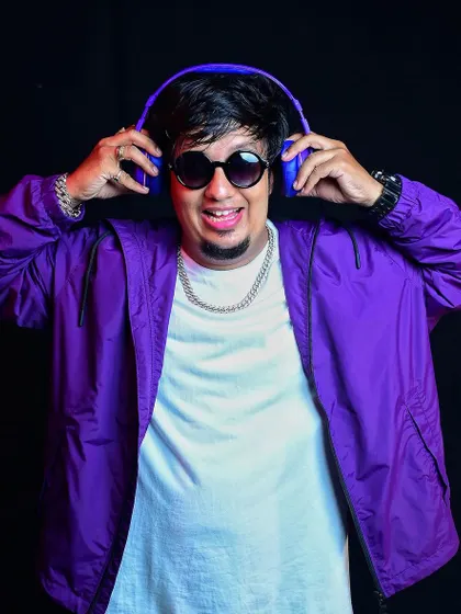 A colorful shot with headphones, reflecting my positive energy. I believe in succeeding against the odds and proving doubters wrong.