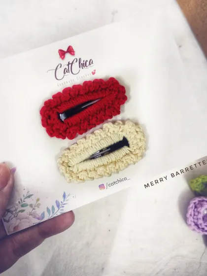 Our "Merry Barrettes" in red and cream, a simple and festive choice for the holidays.