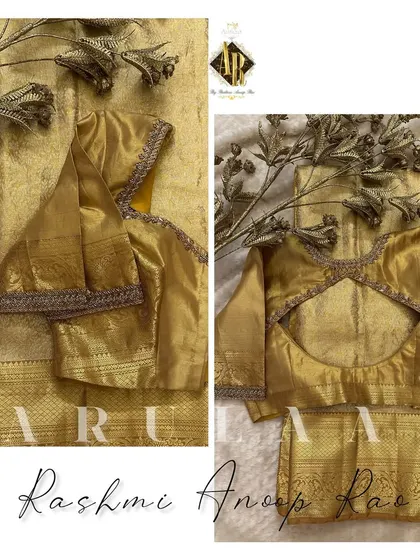 A simple gold blouse with a keyhole cutout at the back. The neckline and sleeves are finished with a delicate embroidered border.