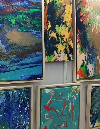 A wall of vibrant, large-scale abstract paintings that our Fine Arts students studied for technique and emotional impact.