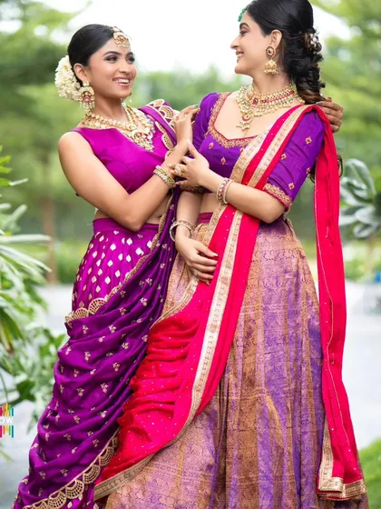 A happy, interactive shot of our half saree collection, perfect for capturing the spirit of a celebration.
