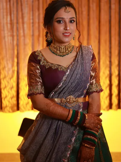 A close-up of the client, showing the intricate details of her custom-made blouse.