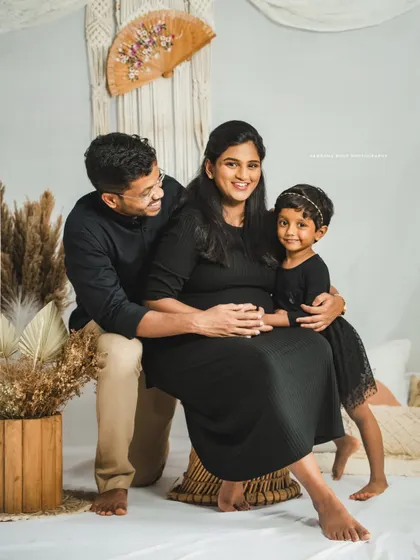 A complete family portrait in my bohemian studio setup. It's wonderful to capture the whole family, including siblings, in these special photos.