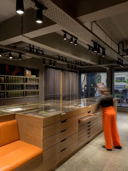 The central display unit is the heart of the showroom, captivating visitors with an array of exquisite samples and materials.