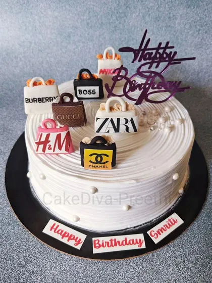The perfect cake for a shopaholic! This design is topped with miniature, handcrafted fondant shopping bags from all her favorite brands like Zara, Chanel, and Gucci.
