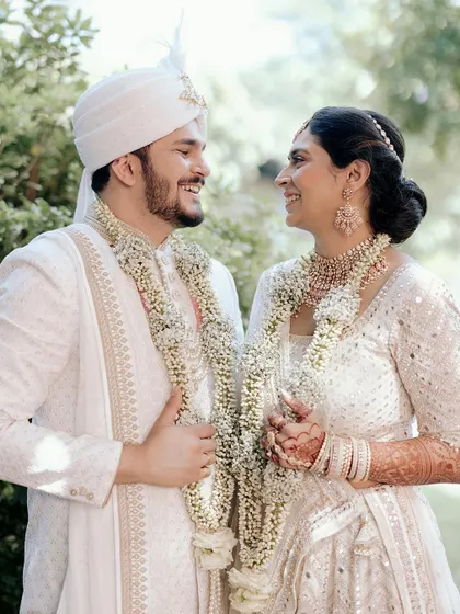 Jui and Vi share a joyful, smiling moment after their ceremony in Pune. Their happiness is radiant in this beautiful, naturally lit portrait.