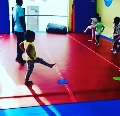 A Friday evening class with our "Good Friends" group. The images show a variety of activities, from warm-up exercises to practicing cartwheels with instructor support.